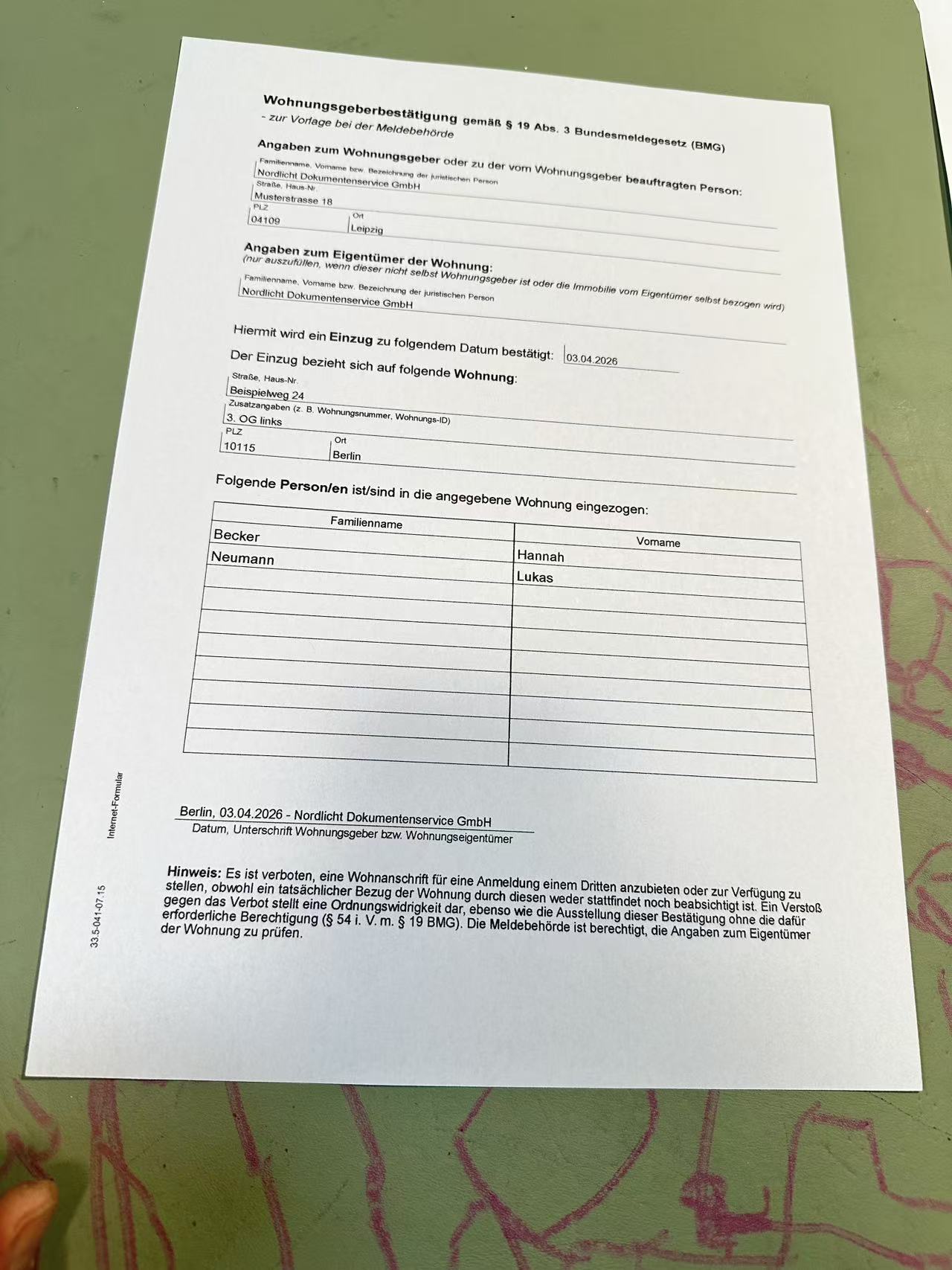 Original photo of a German registration form on a desk